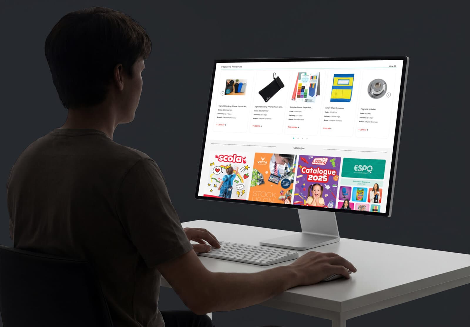 A monitor showing the Eduplan Featured Products carousel and a row of vendor catalogue brand tiles