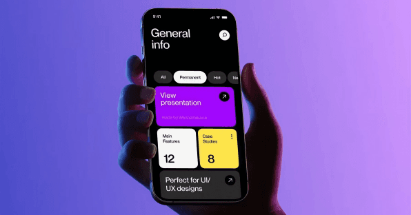 Hand holding a phone showing a mobile app home screen